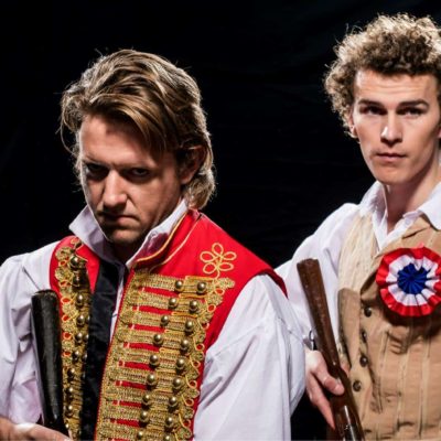 TRENT RICHARDS as Enjolras and WILLIAM TOFT as Marius. PHOTO CREDIT Mark Duffus